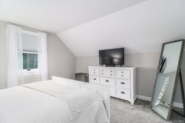 bedroom with light carpet and lofted ceiling