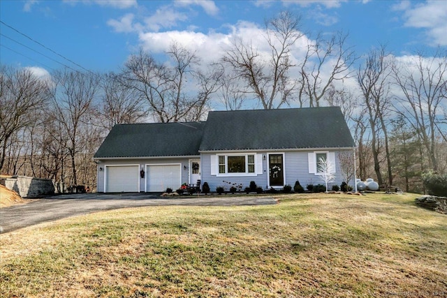 view of front of home with a garage and a front yard