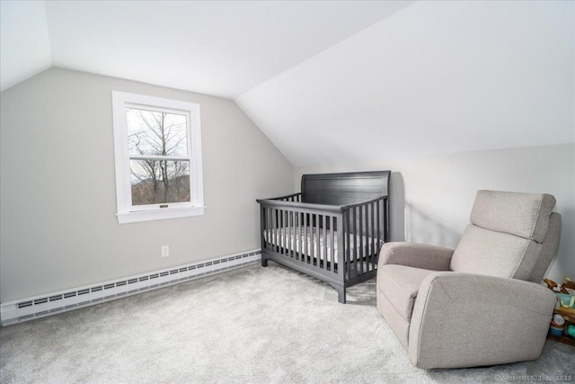 bedroom featuring light carpet, a nursery area, vaulted ceiling, and a baseboard heating unit