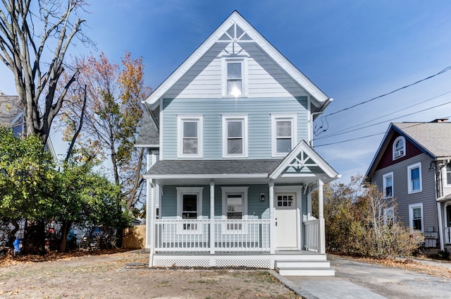 victorian-style house featuring covered porch