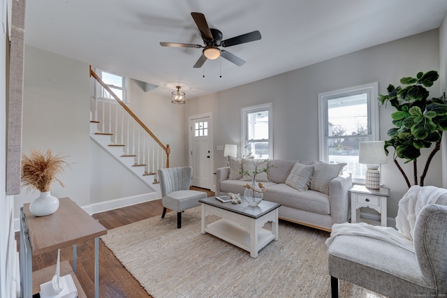 living room with hardwood / wood-style flooring and ceiling fan