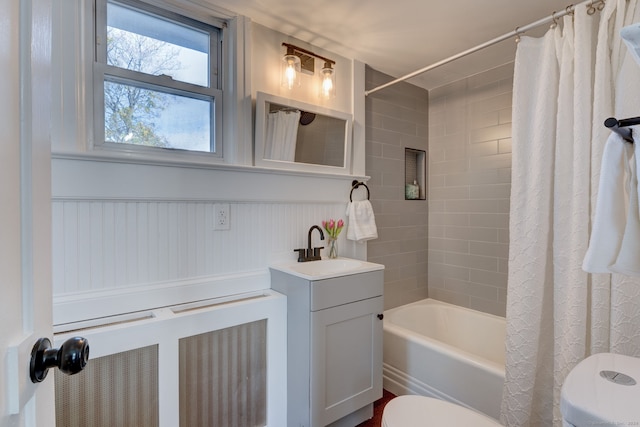 full bathroom featuring shower / bathtub combination with curtain, vanity, and toilet