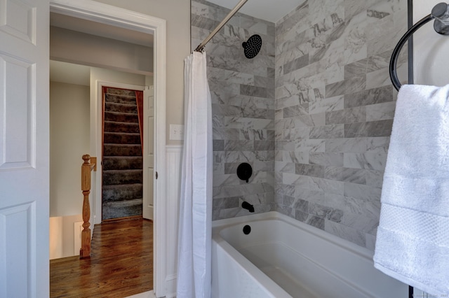 bathroom featuring shower / tub combo and wood-type flooring