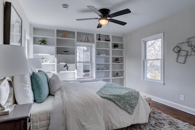 bedroom with hardwood / wood-style floors and ceiling fan