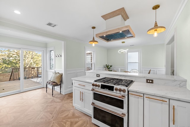 kitchen featuring white cabinetry, double oven range, and pendant lighting