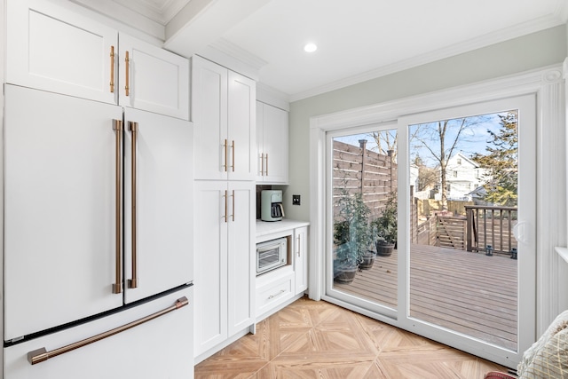 doorway featuring light parquet flooring and ornamental molding