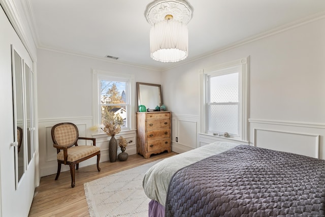 bedroom featuring crown molding and wood-type flooring