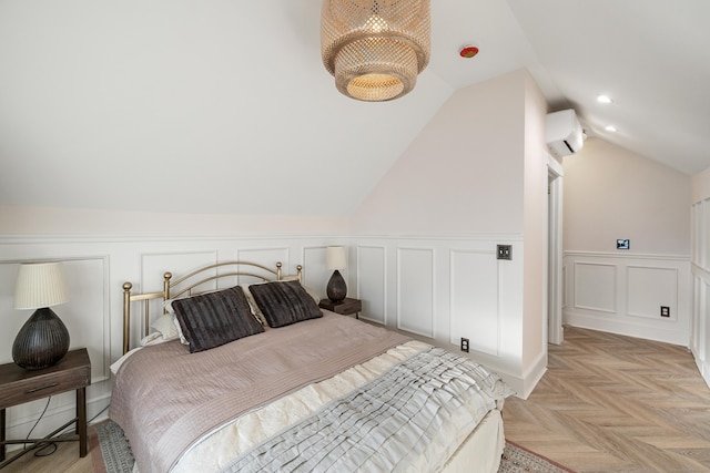 bedroom featuring lofted ceiling, a wall mounted AC, and light parquet floors