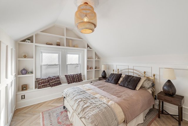 bedroom with light parquet floors