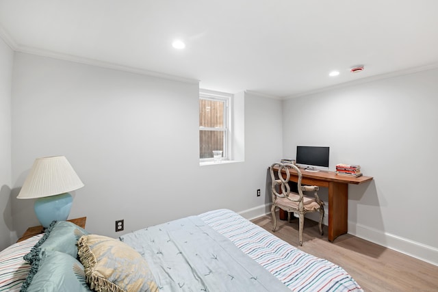 bedroom with ornamental molding and light wood-type flooring