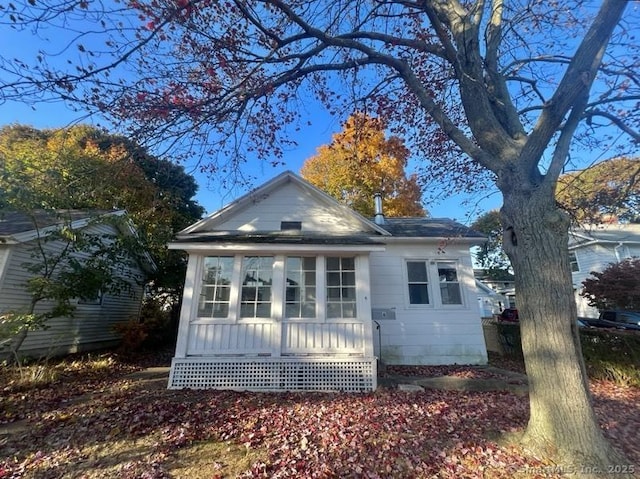 view of home's exterior featuring a sunroom