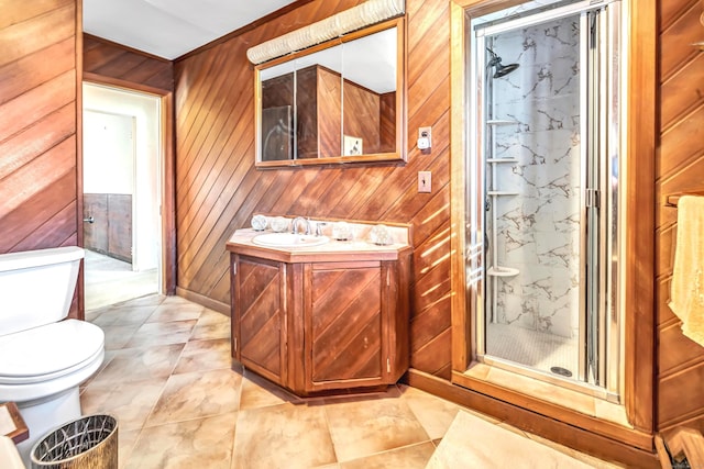 bathroom featuring toilet, wooden walls, walk in shower, and vanity