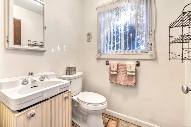 bathroom featuring toilet and vanity