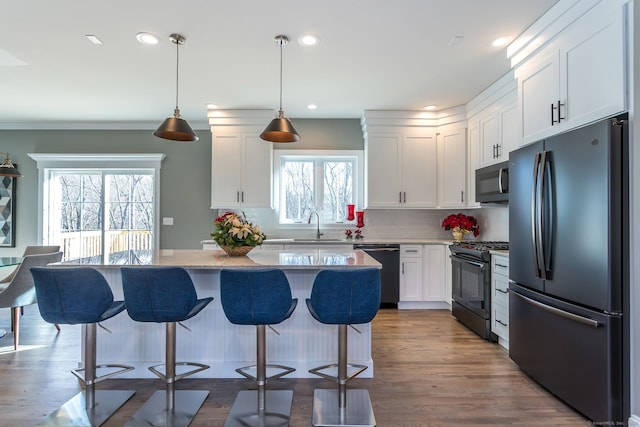 LOT7 Deerwood Rd, Oxford, CT 06478 - kitchen featuring black appliances, a kitchen island, white cabinets, healthy amount of natural light, and recessed lighting