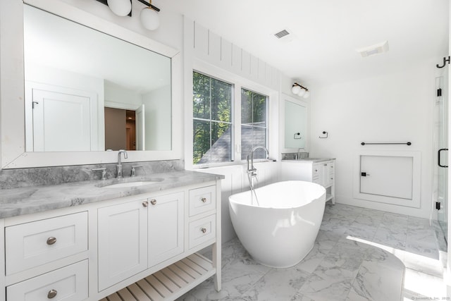 LOT7 Deerwood Rd, Oxford, CT 06478 - bathroom featuring marble finish floors, a soaking tub, two vanities, and a stall shower