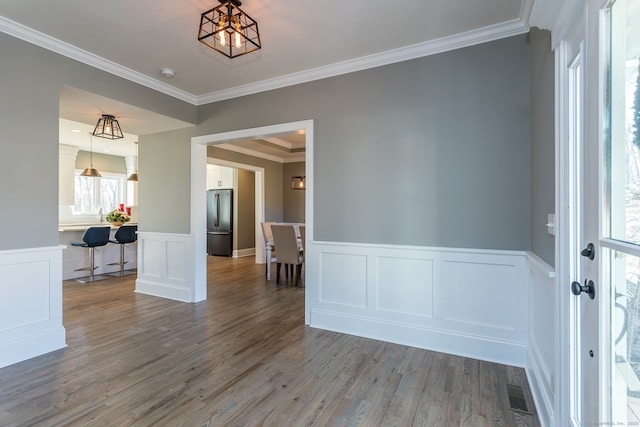 LOT7 Deerwood Rd, Oxford, CT 06478 - unfurnished room with ornamental molding, wood finished floors, a wainscoted wall, a decorative wall, and a chandelier
