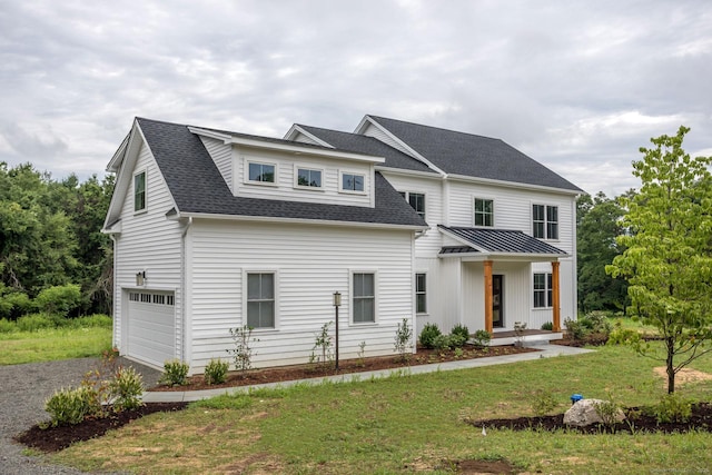 view of front of house with a garage, gravel driveway, a front yard, and roof with shingles