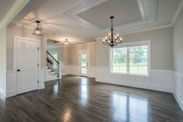 LOT7 Deerwood Rd, Oxford, CT 06478 - empty room featuring a chandelier, stairs, a wainscoted wall, a raised ceiling, and dark wood finished floors
