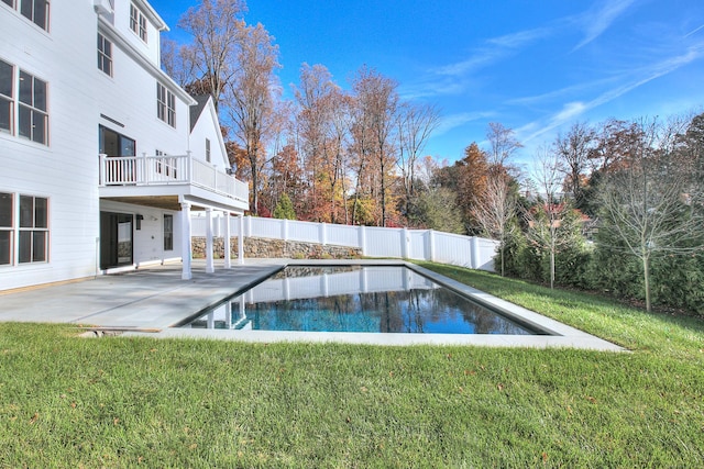 view of swimming pool with a lawn and a patio area