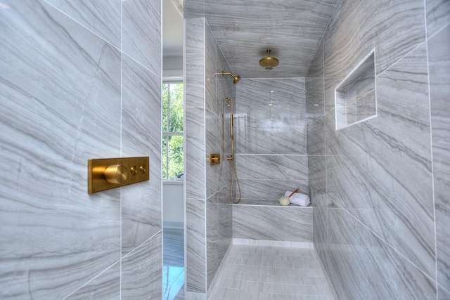 bathroom with a tile shower