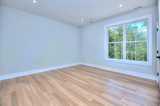 unfurnished room featuring light wood-type flooring