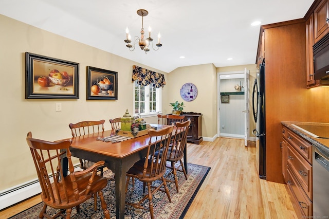 dining space featuring light hardwood / wood-style floors, lofted ceiling, and a chandelier