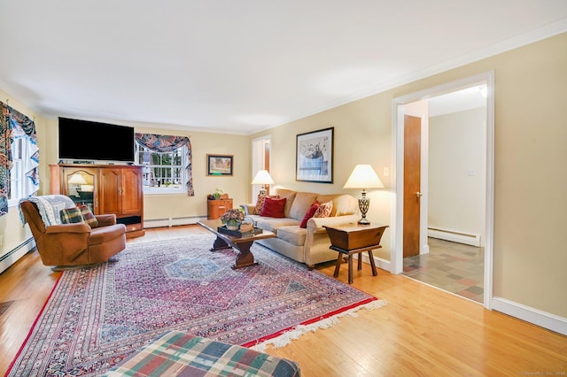 living room featuring crown molding, light hardwood / wood-style flooring, and a baseboard radiator