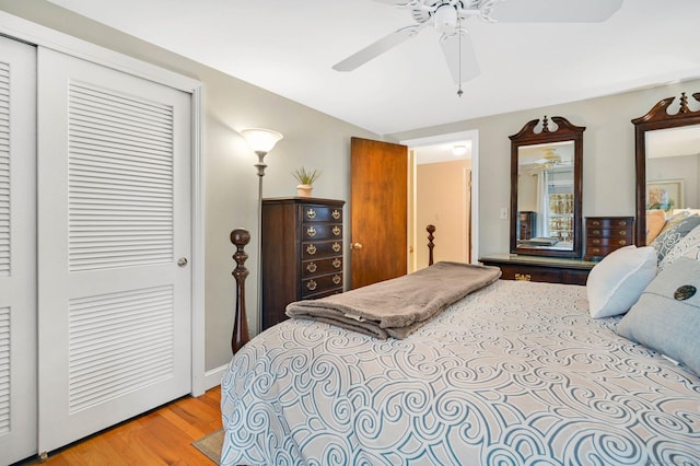 bedroom featuring ceiling fan, a closet, and light wood-type flooring