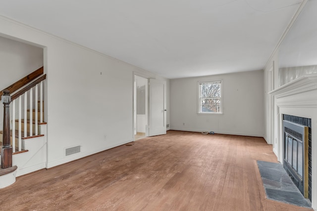 unfurnished living room with wood-type flooring