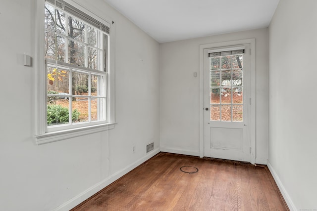 doorway featuring dark hardwood / wood-style floors