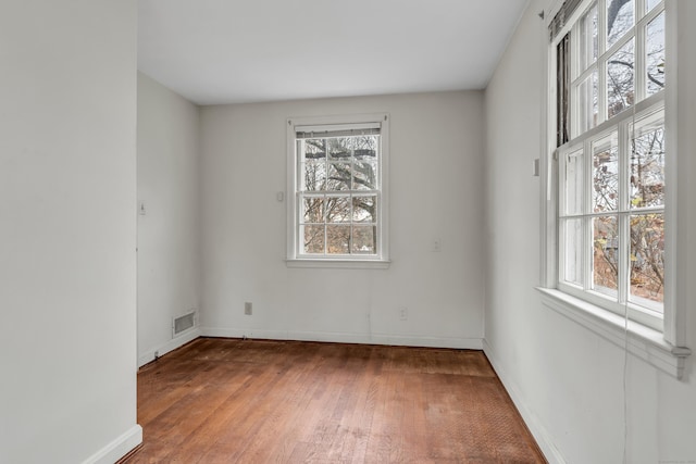 empty room featuring hardwood / wood-style floors