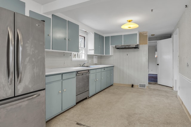 kitchen with appliances with stainless steel finishes, ventilation hood, and sink