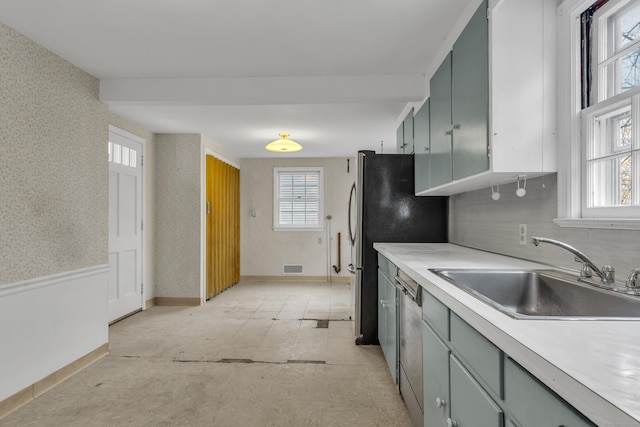 kitchen featuring stainless steel dishwasher and sink