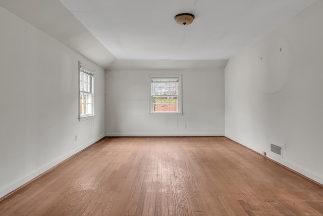 spare room featuring light wood-type flooring