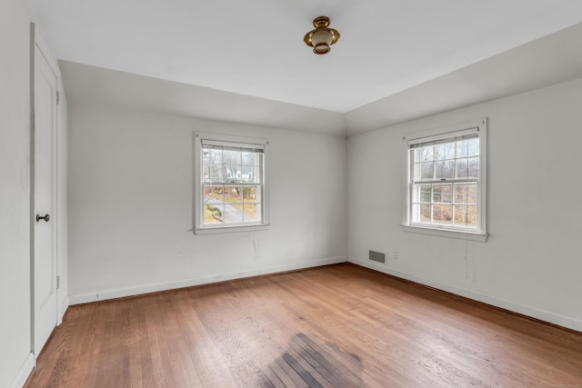 unfurnished room with light hardwood / wood-style floors