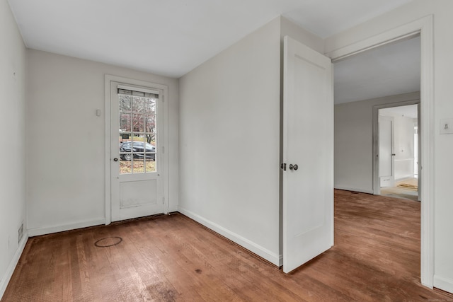 empty room featuring hardwood / wood-style floors