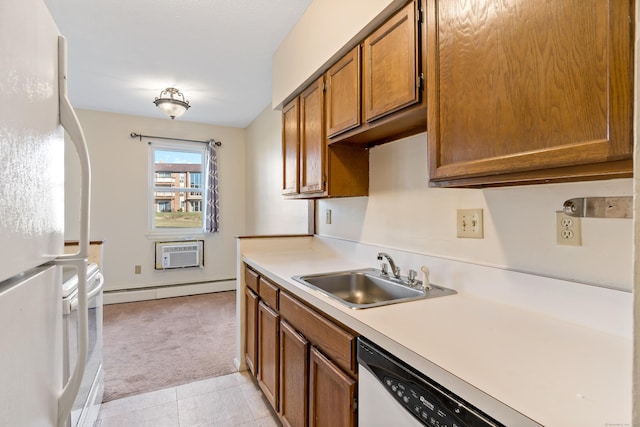 kitchen featuring a wall mounted air conditioner, white appliances, light colored carpet, sink, and a baseboard radiator