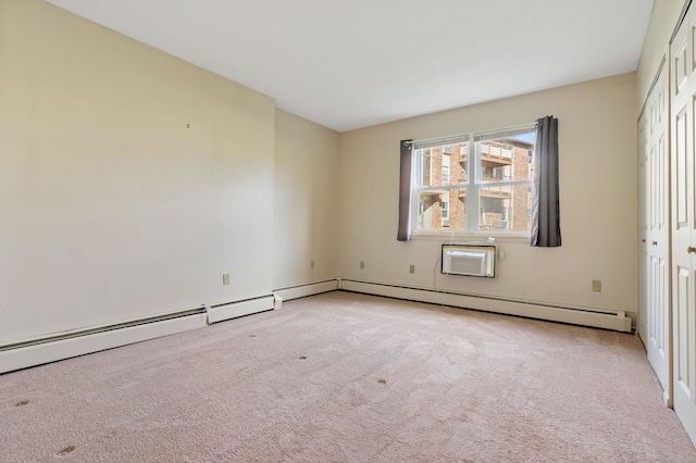 spare room featuring light carpet and an AC wall unit