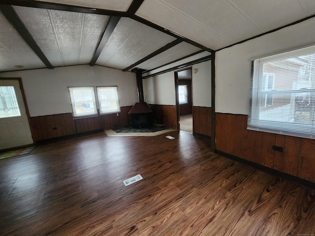 unfurnished living room with wood-type flooring and a textured ceiling