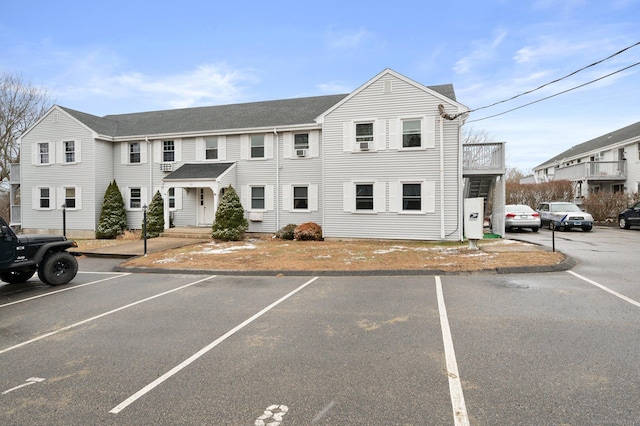 view of front of house with a balcony