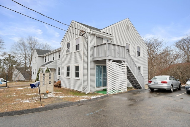 view of side of home with a balcony