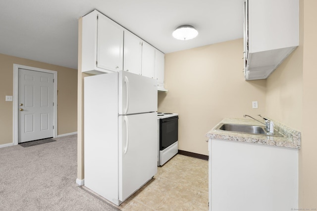 kitchen featuring white appliances, light carpet, exhaust hood, sink, and white cabinetry