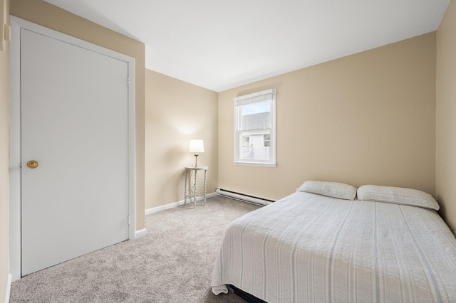 bedroom with carpet and a baseboard radiator