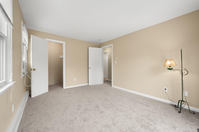 unfurnished bedroom with light carpet