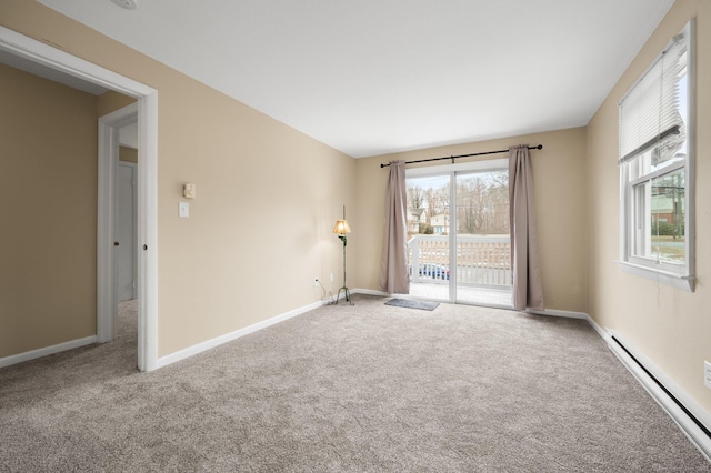 empty room featuring carpet and a baseboard radiator