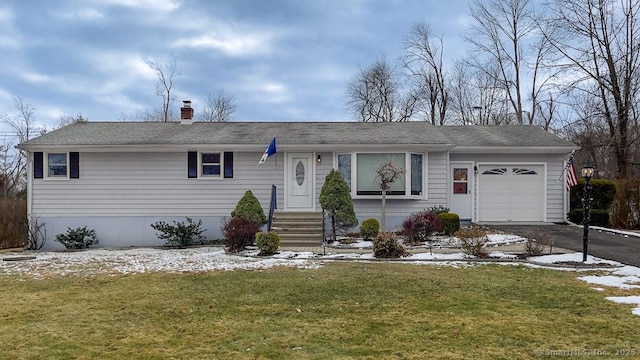 single story home with a front lawn and a garage