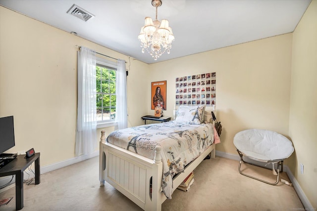 carpeted bedroom with a notable chandelier