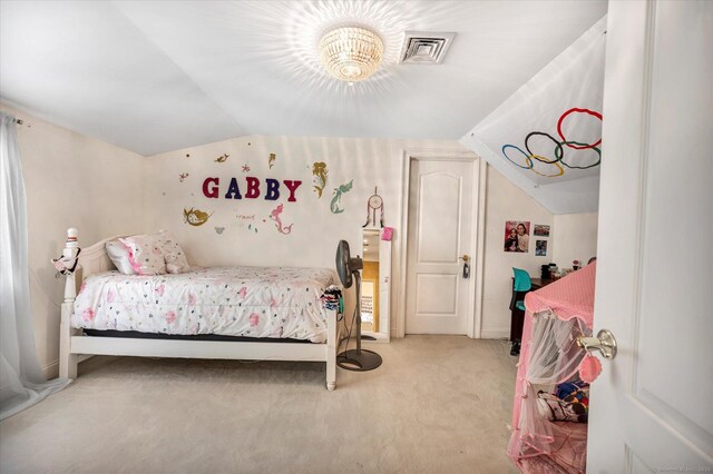 bedroom with lofted ceiling and carpet floors