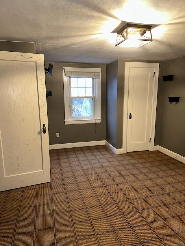 empty room with a textured ceiling