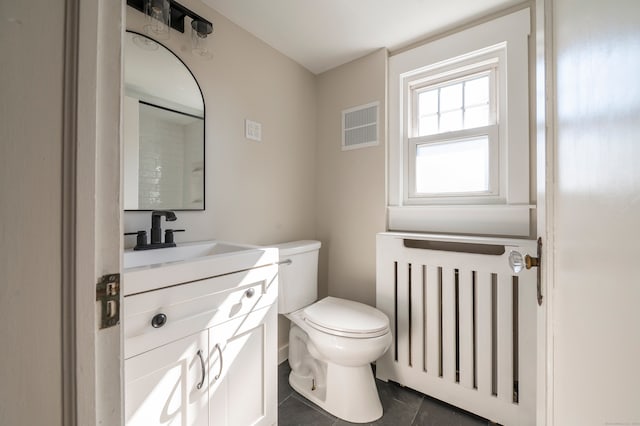 bathroom featuring visible vents, toilet, radiator heating unit, tile patterned floors, and vanity